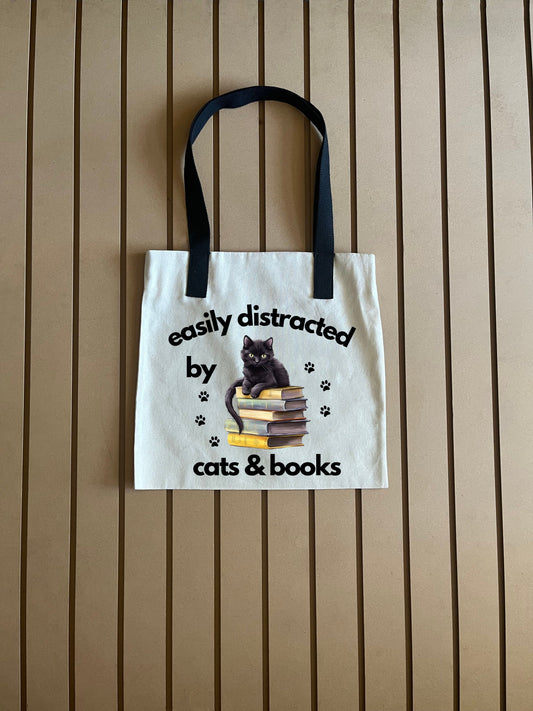 Easily distracted at sleeping on multi books - 45 - Tote Bag